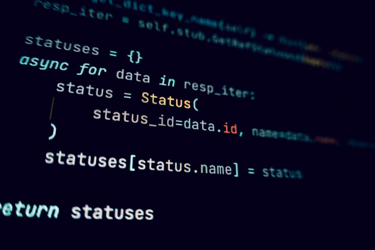 Software developer coding NestJS API rate limiting strategies on a laptop in a modern office workspace
