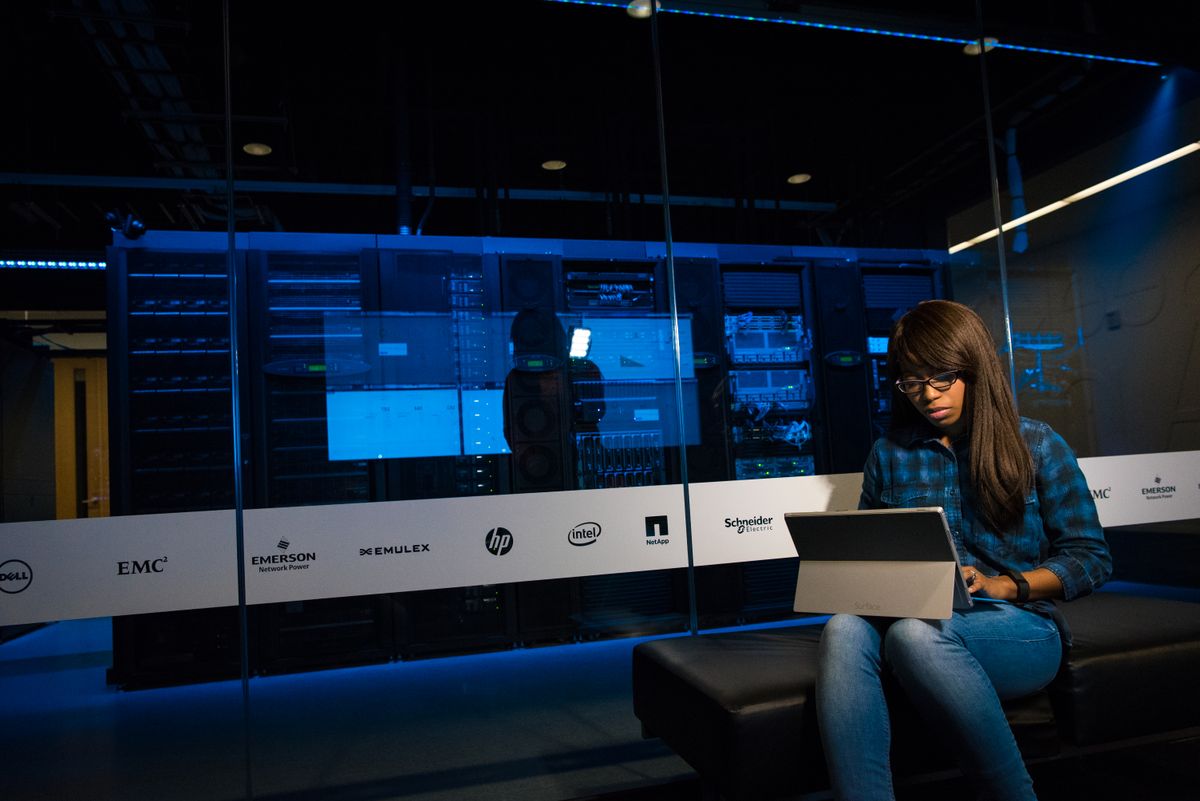 Engineer running a large-table backfill on a production database from a laptop in a data center