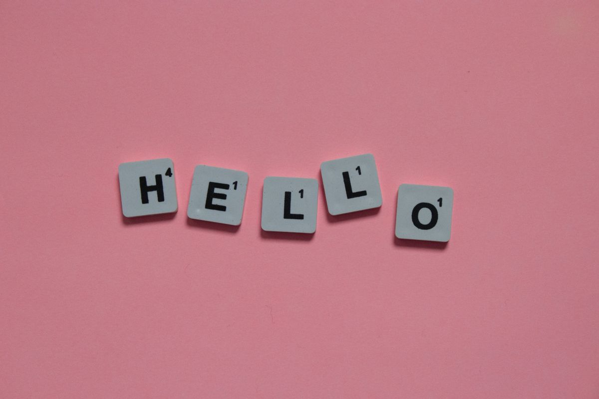 Next.js SaaS internationalization concept — letter tiles spelling Hello representing multilingual product support