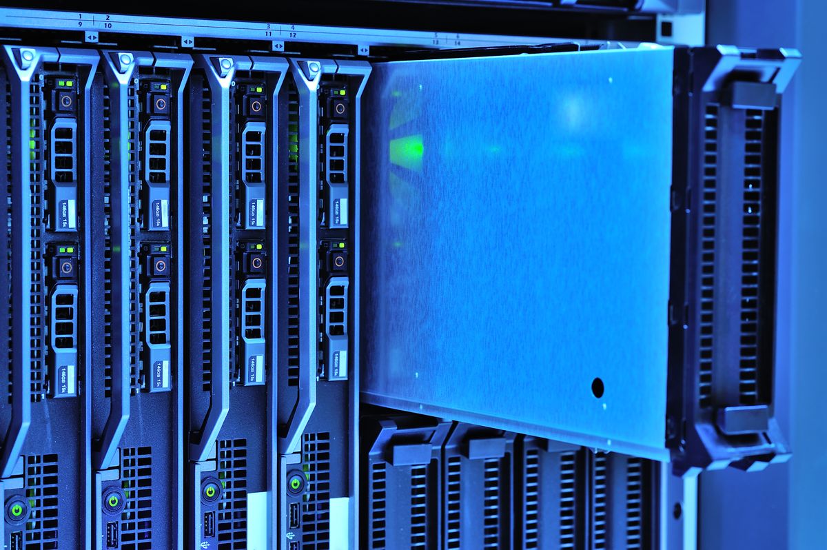 Server racks with glowing lights in a data center representing the docker nestjs production multi-stage build optimization deployment infrastructure