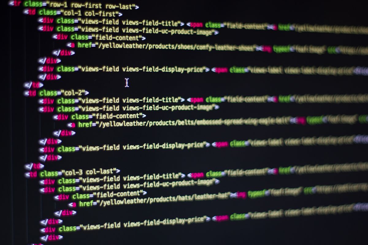 Close-up of HTML code on a computer monitor representing environment variables and configuration