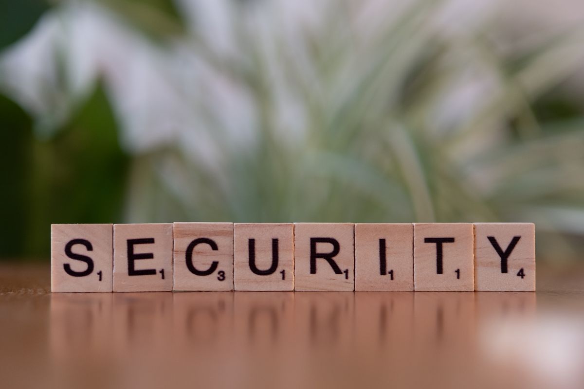 Cyber security virus scanning concept — tiles spelling SECURITY representing antivirus protection for uploaded files
