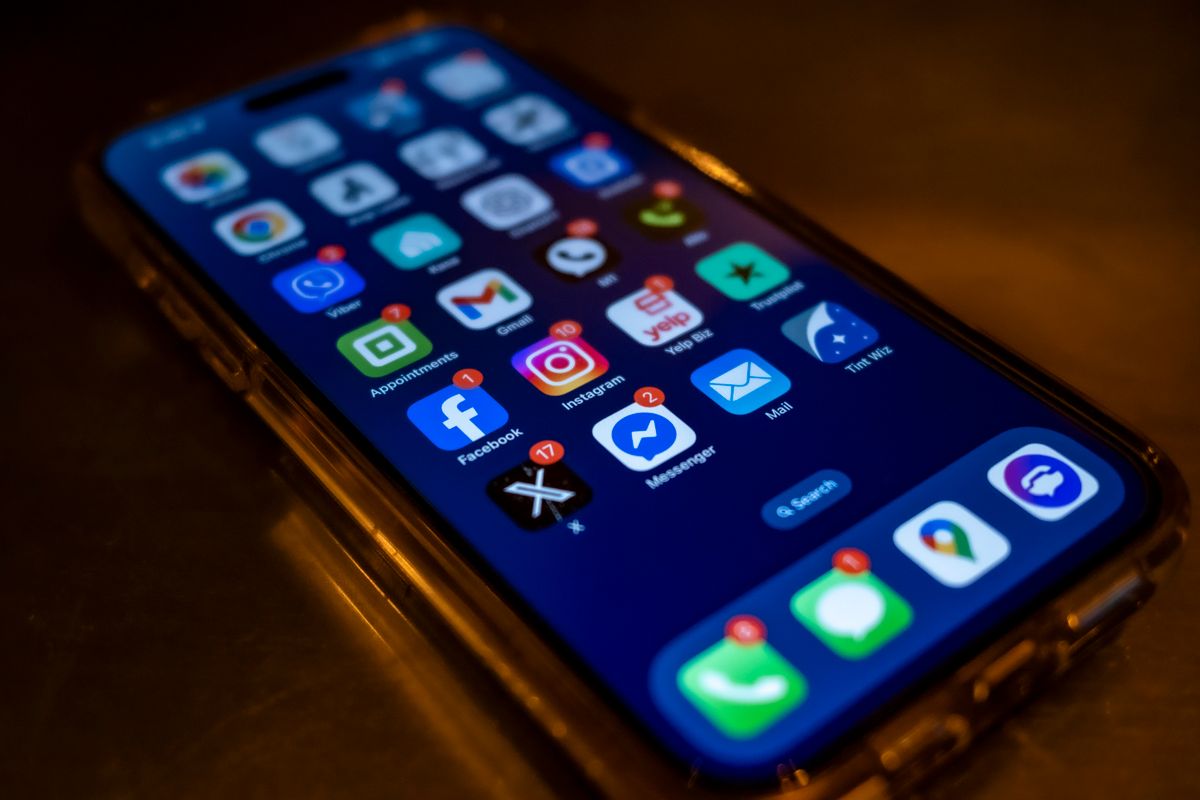 SaaS real-time notifications NestJS implementation — smartphone screen showing app notification alerts