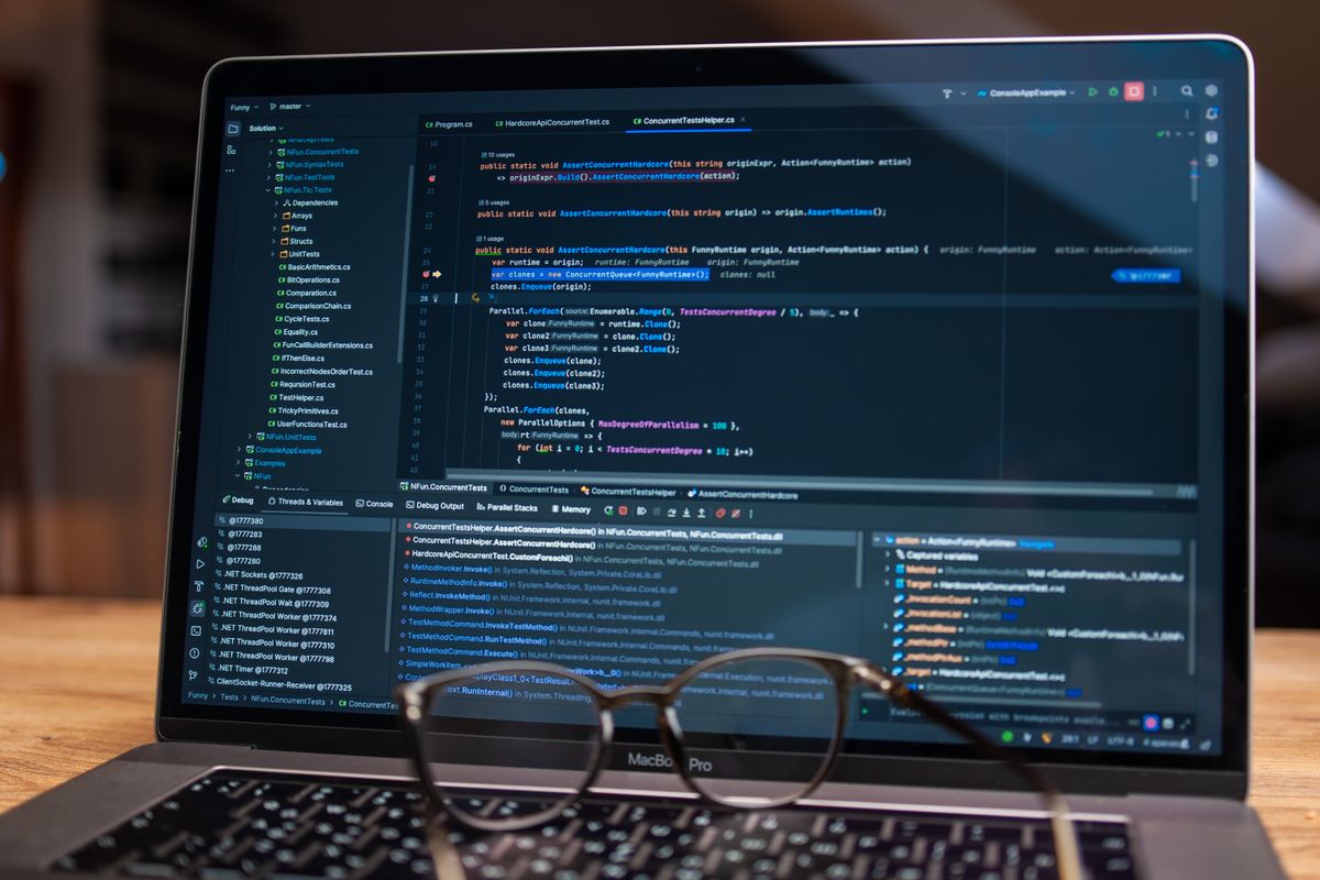 Public developer API sandbox environment — a laptop showing debugging code, representing isolated integration testing