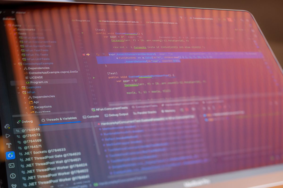 Programming code with reflections visible on a computer screen, representing the keep-alive configuration that resolves the dropped connection