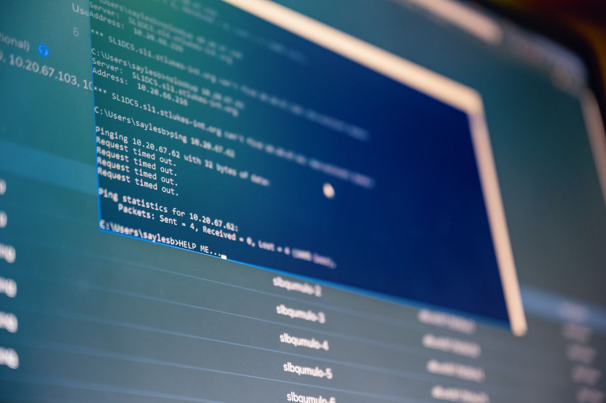 Database code on a monitor representing Oracle to PostgreSQL migration challenges
