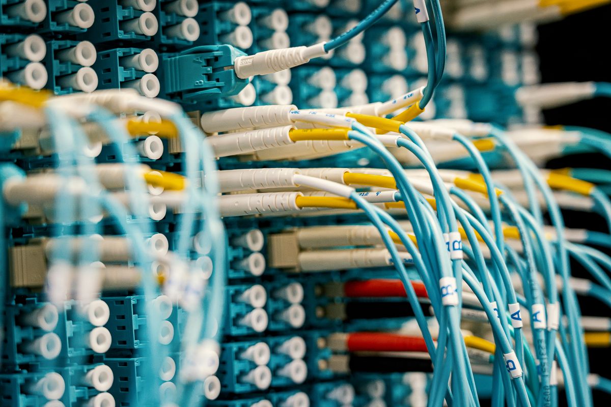 Server racks in a data center representing the infrastructure needed to add REST API legacy Java application