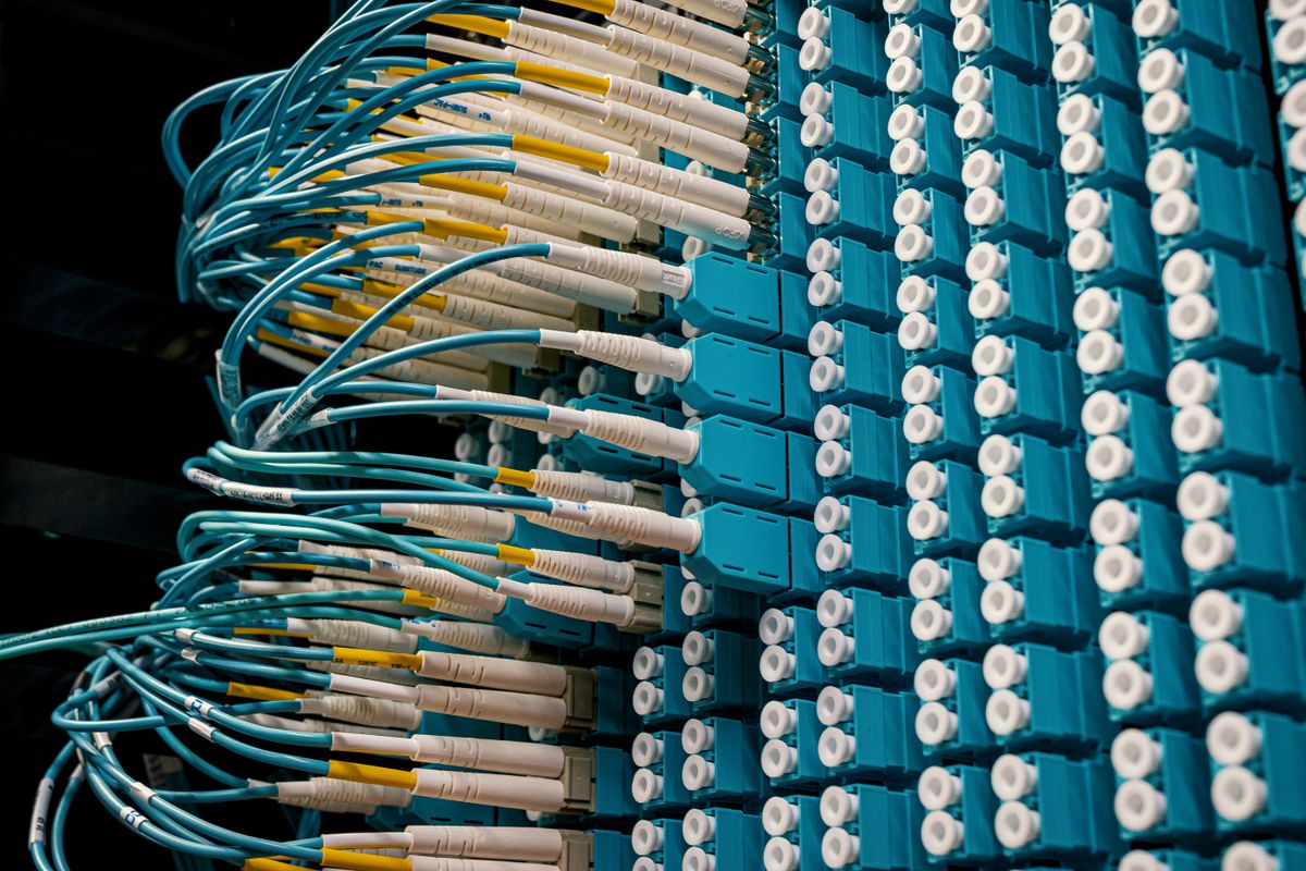 API idempotency and network timeouts — network cables in a server rack, where lost responses trigger client retries