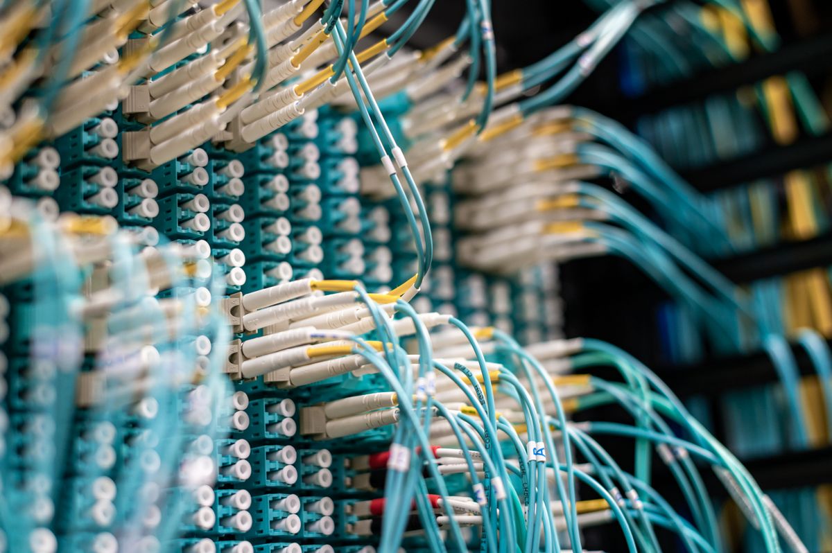 Server and database cables representing data migration infrastructure for Oracle to PostgreSQL migration challenges