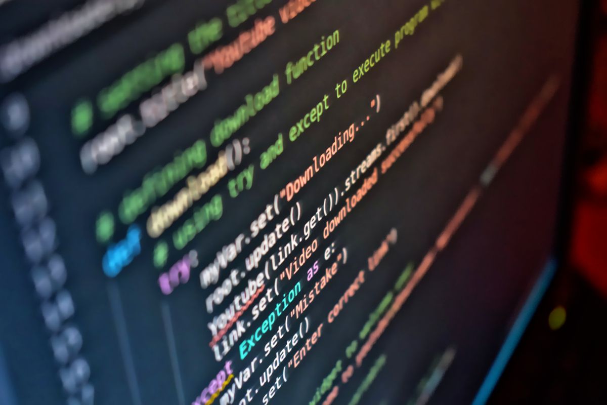 NextJS App Router vs Pages Router comparison — vivid close-up of source code on a screen representing a web framework routing decision