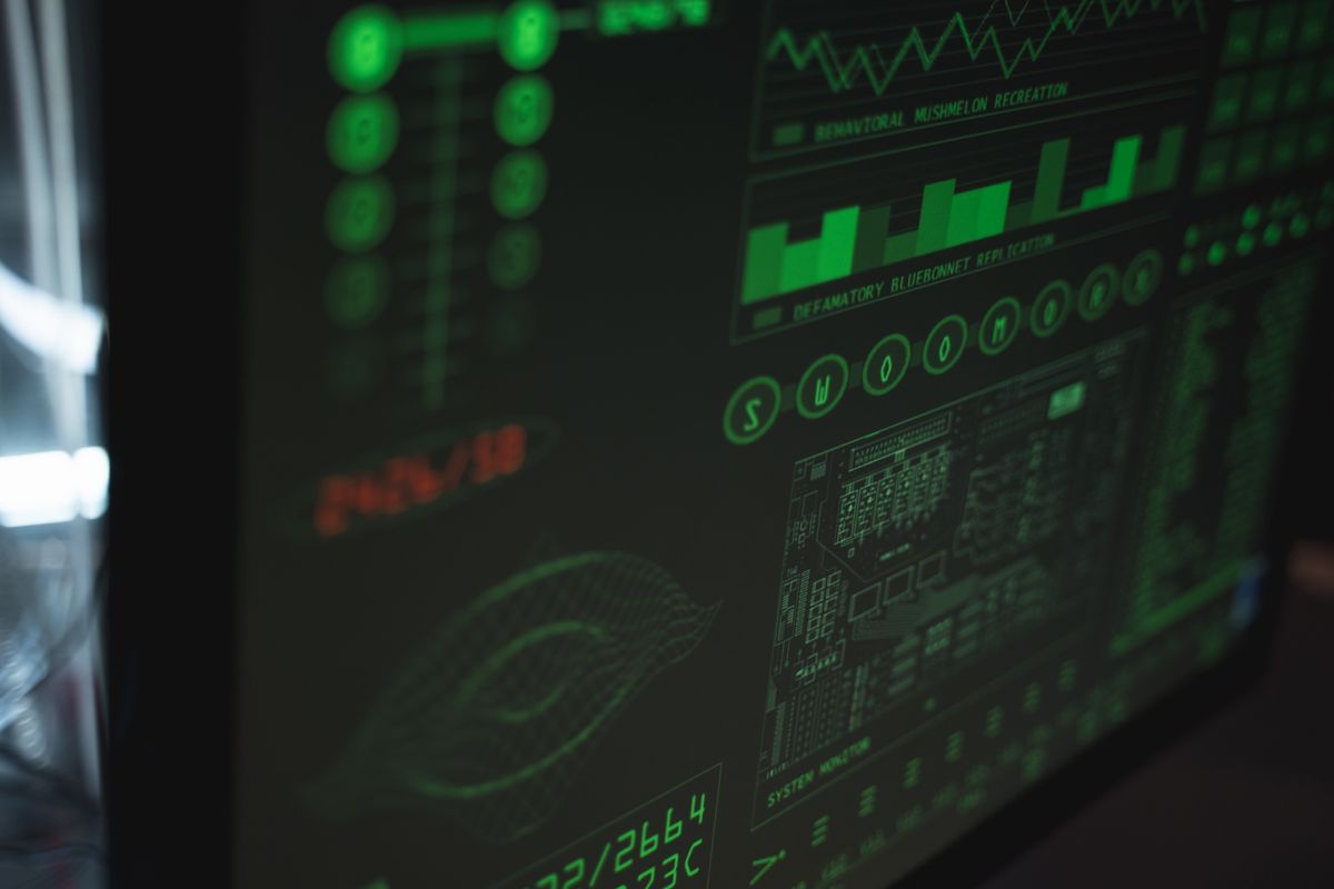 A computer display showing cybersecurity and data protection interfaces in green monitoring tones