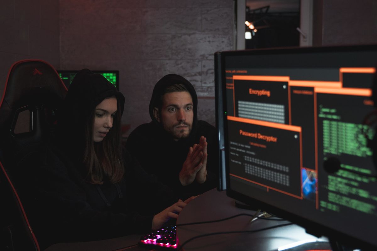 Broken authentication vulnerability — cybersecurity professionals analyzing data on computer screens in a security operations center