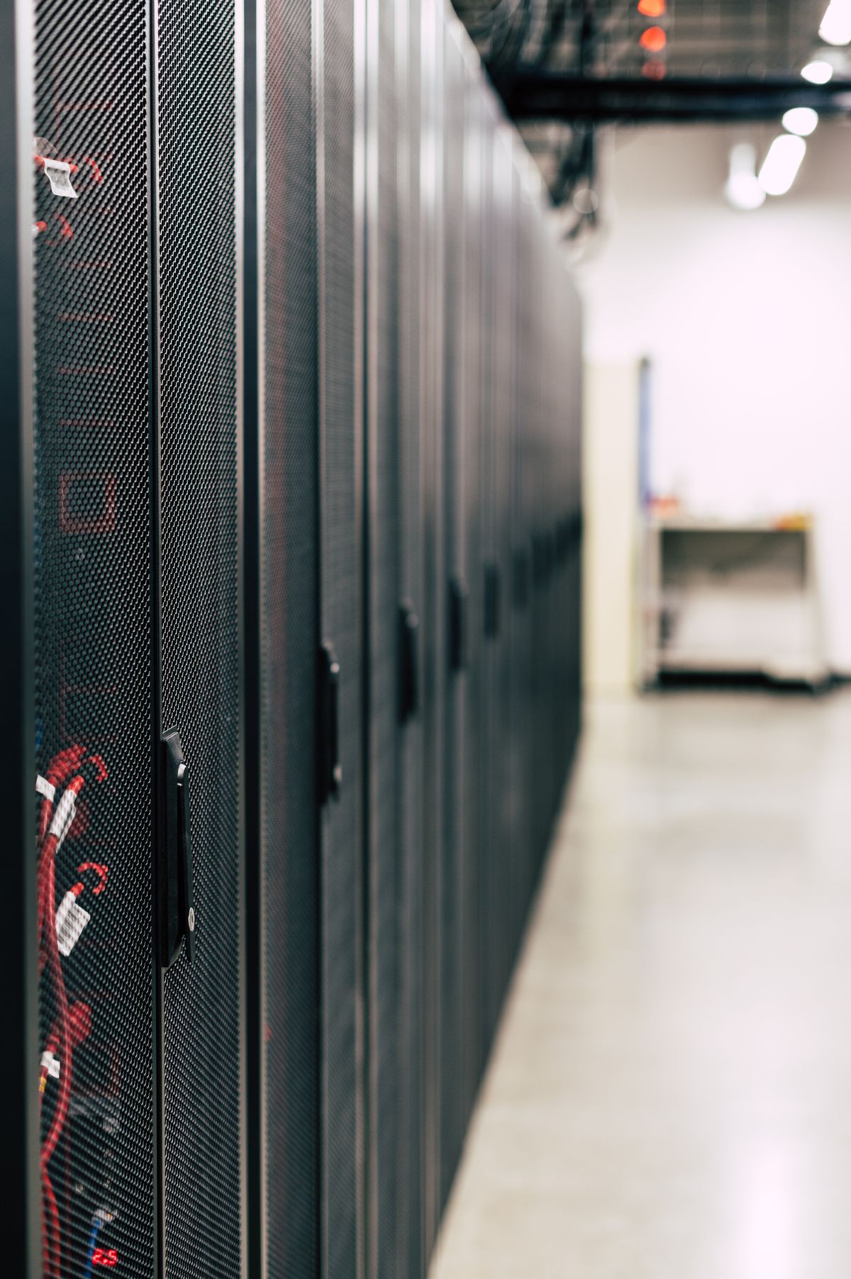 Server infrastructure with optic fiber cables representing NestJS API rate limiting and server protection in a modern data center