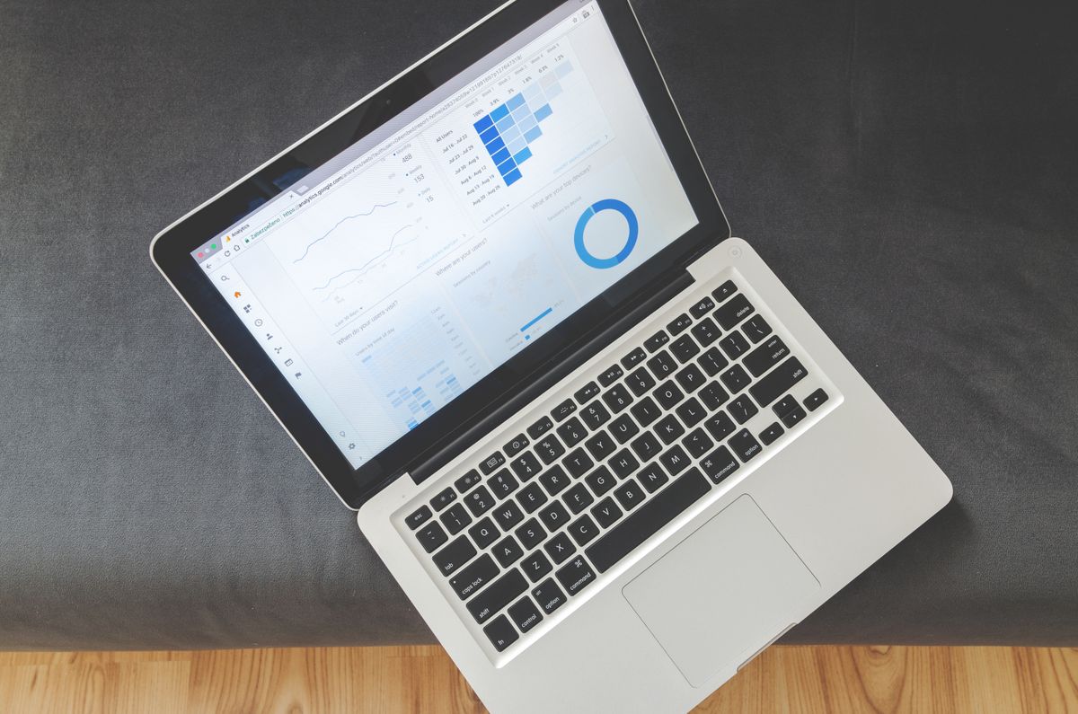 Laptop displaying data visualizations and chart analytics representing dashboard performance improvements and metrics