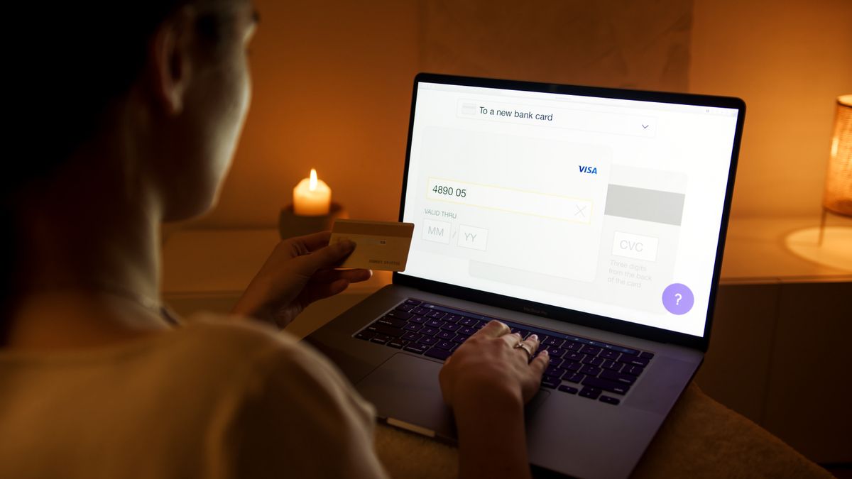 SaaS billing portal concept — a customer making a secure online payment with a laptop and credit card