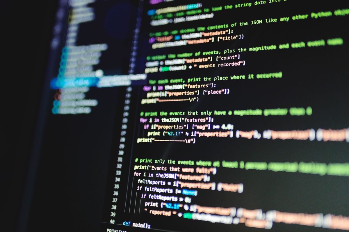 NestJS event-driven architecture implementation — close-up of JavaScript code displayed on a monitor highlighting programming concepts