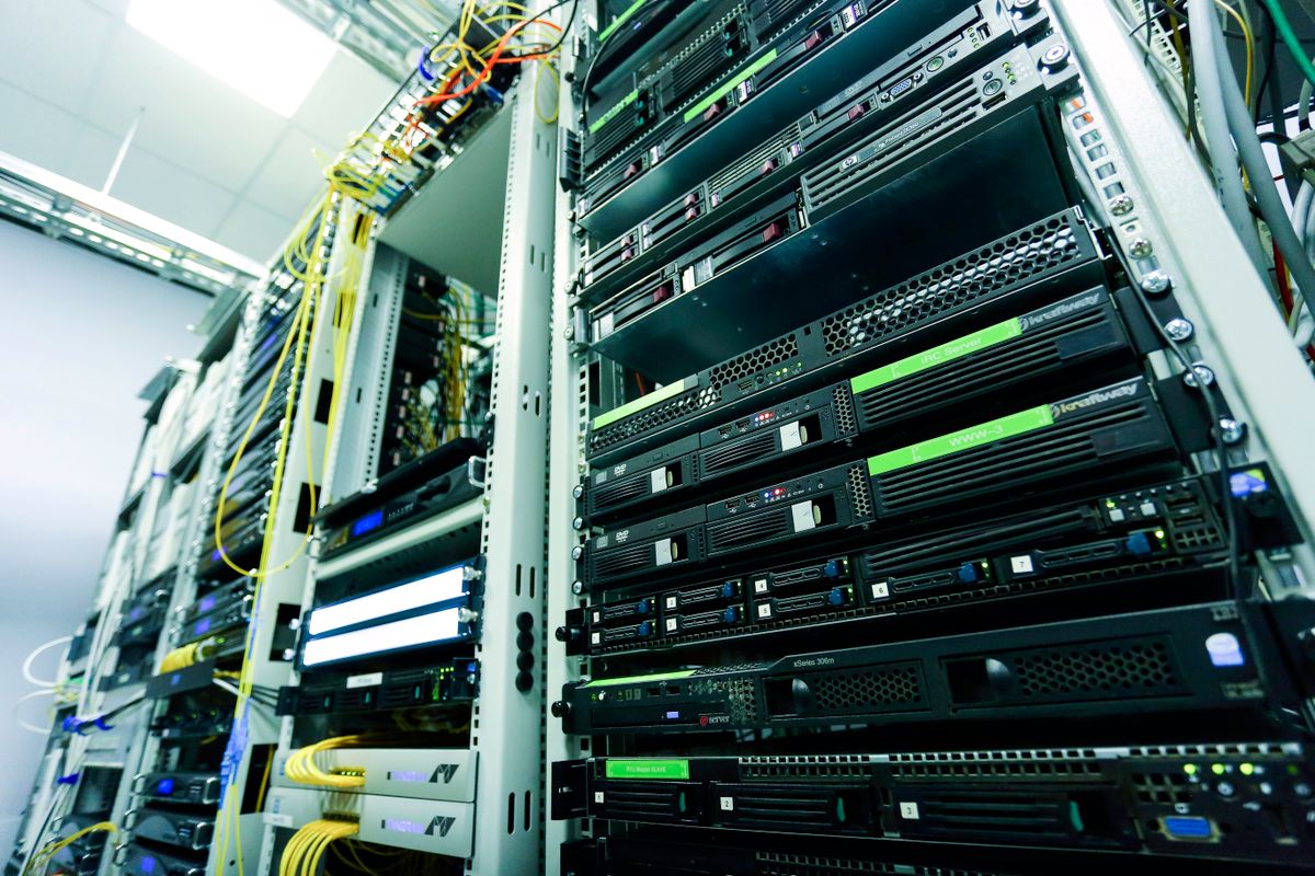 High-tech server rack in a secure data center with network cables and hardware components