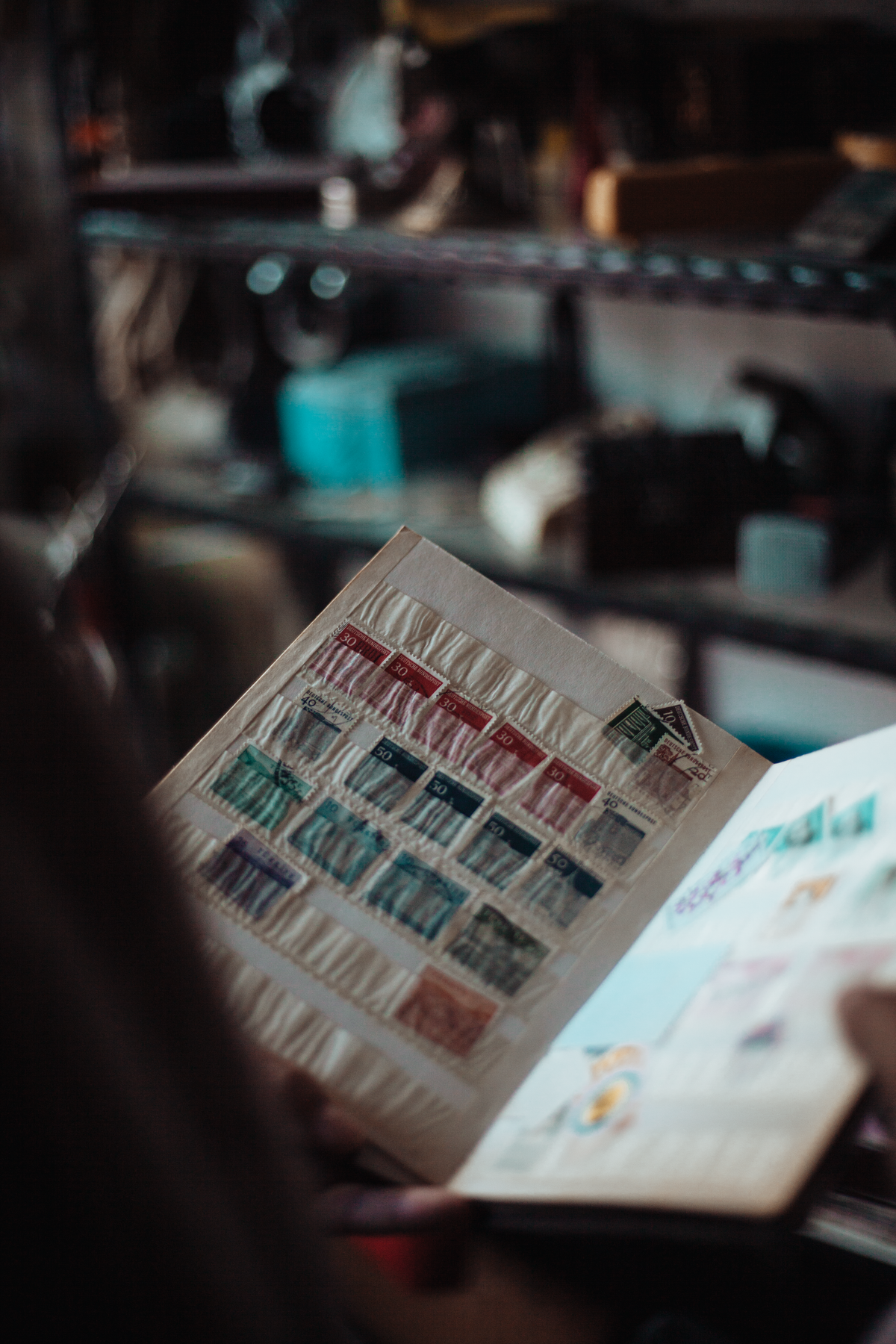 A vintage collection of postage stamps displayed in an album, representing the deprecated Cloudflare Pages adapter that a lot of existing guidance still describes as current