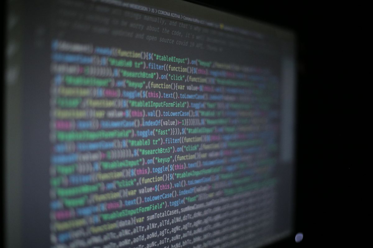 Colorful programming code on a screen representing the development work to add REST API legacy Java application without refactoring