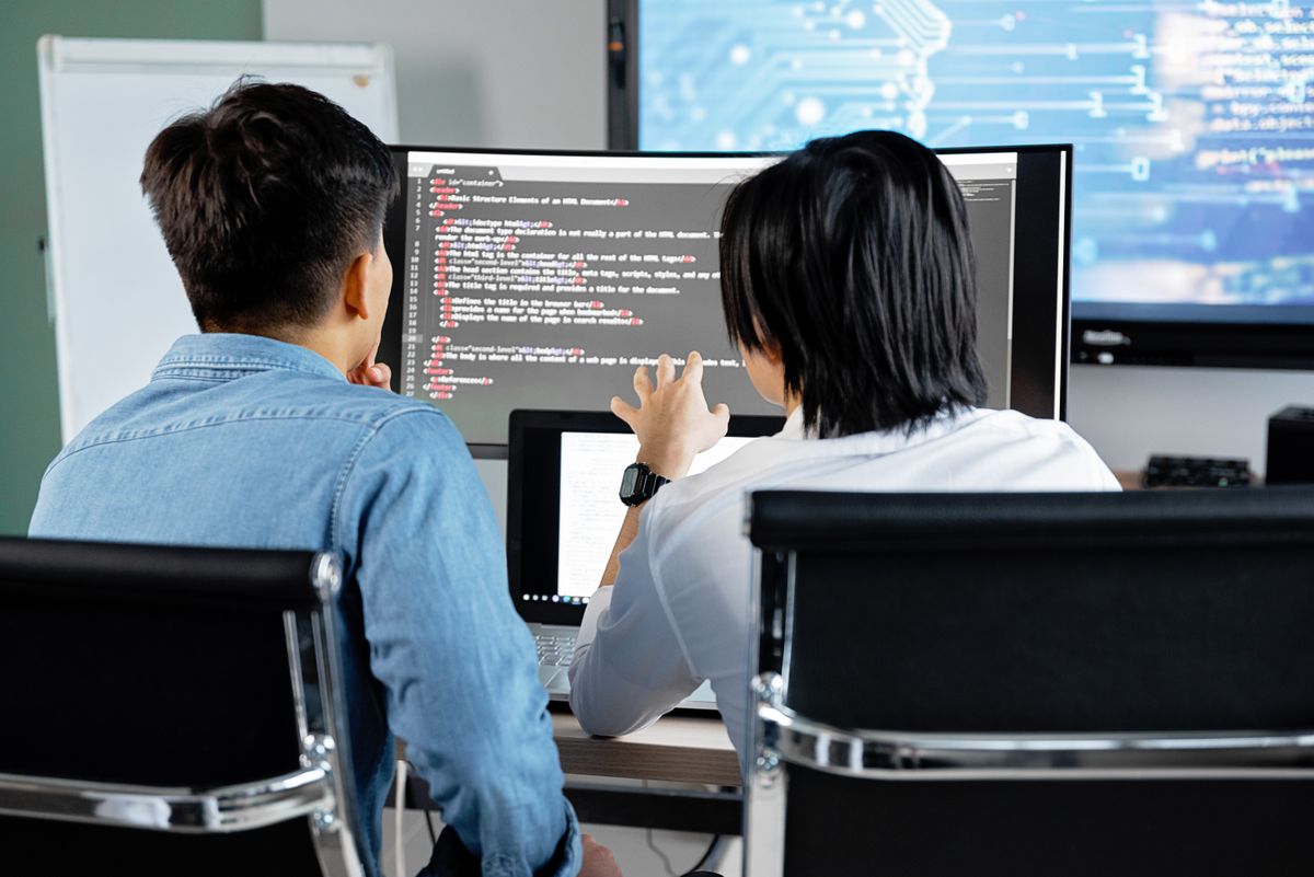 A development team collaborating on a NestJS codebase in an office