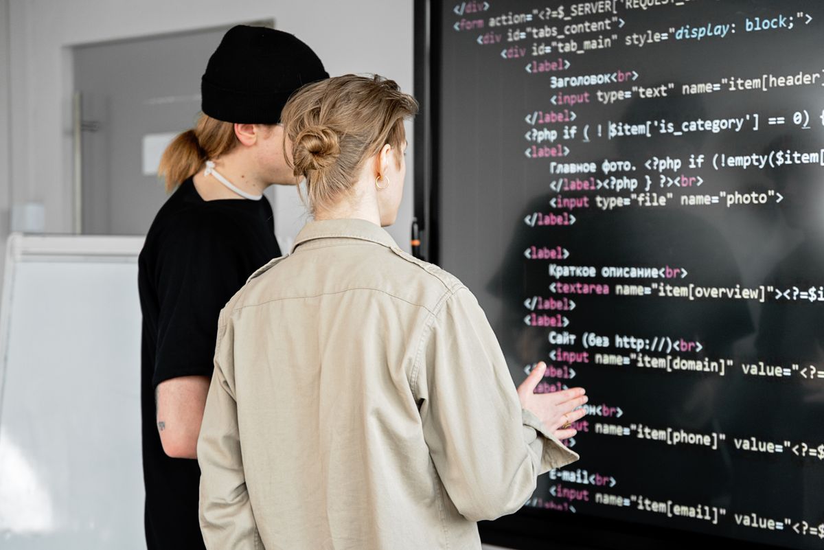 Two developers sharing TypeScript types across the backend and frontend of a SaaS monorepo