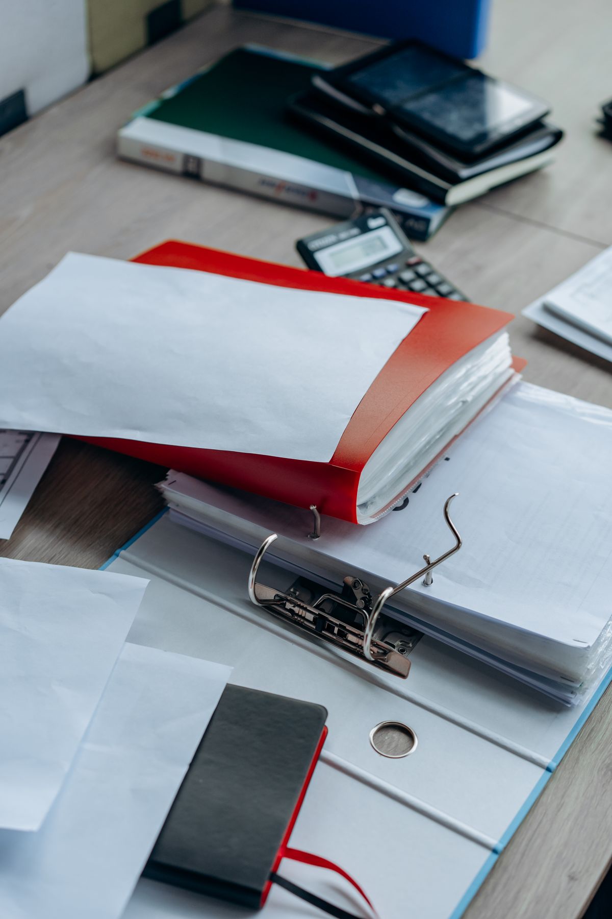 A tidy office desk with organized binders and papers, representing a build output structure worth double-checking before assuming a path is correct